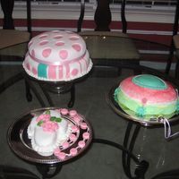 Pink Beauties These are my first professional cakes. They were used for a baptism reception. Thus the rosary, the two tier one is to tie the color scheme...