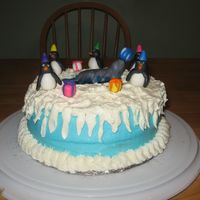Penguin Birthday Cake Lemon cake with lemon pudding filling. Piping gel was used for the water, fondant for the penguins, presents, and seals. Buttercream icing...