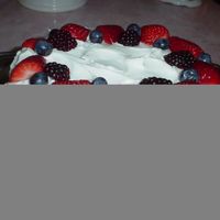 Lemon Cake buttercream icing and fresh strawberries, blueberries and raspberries