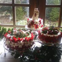 Poinsettia Wedding Cake This cake is 3 tiers, 6 for top 8 for middle and 10 for the bottom with white whipped icing. Poinsettias are white and burgundy/red and are...