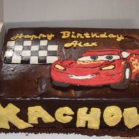 Chocolate Ganache Lighting Mcqueen Cake Made this for my nephew's birthday. Chocolate cake w/ whipped chocolate/raspberry ganache filling, then covered w/ dark chocolate...