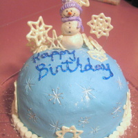 Winter Birthday Cake Nicki's Christmas Day birthday cake. Chocolate fudge cake with a surprise whipped chocolate ganache center, covered in buttercream....