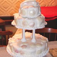 Seashell Tiered Cake Three tiers, chocolate fudge cake filled with chocolate fudge frosting, topped with vanilla buttercream and then MMF. White chocolate...