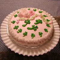 St. Patty's Day Cake The ribbon says "Good Luck + Erin Go Braugh!". Chrysanthemum flowers and shamrocks from buttercream. Crown shell edge and reverse...