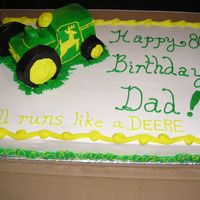 80Th Birthday Cake With 3-D John Deere Tractor Yellow butter cake with buttercream icing. Tractor was two small pound cakes (store bought) and a the wheels were made of the small...