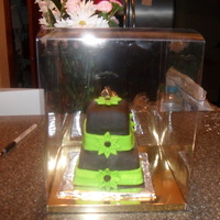 Mini Cake Chocolate cake buttercream frosting covered with Chocolate fondant.