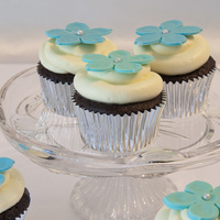 Wedding Shower Cupcakes Chocolate cupcakes with buttercream icing and fondant flowers.