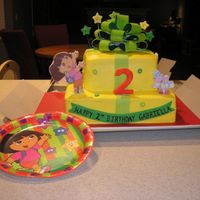 Dora Buttercreme with fondatnaccents and fondant plaques. Bow premade from Wilton.