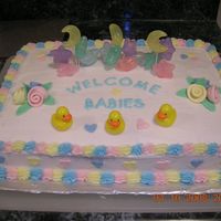 Baby Shower Cake Made this for an office who had three women expecting. Buttercake with buttercream icing, with fondant roses, fondant cutout hearts and...