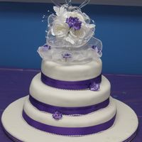 080.jpg My sons wedding cake6", 8" and 10" round, with purple ribbon around fondant