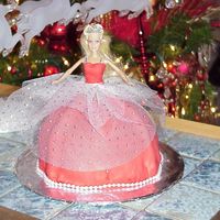 Holiday Birthday Cake Chocolate cake with vanilla filling covered in Satin Ice.