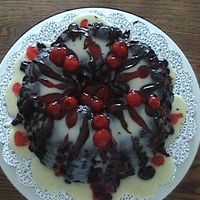 Dsc00642.jpg I made this for a baking contest. I didn't win but my husband loved it. I baked cherries inside the cake and covered with white and...