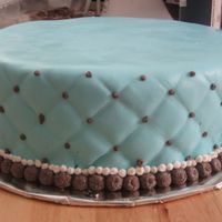 Blue And Brown Shower Cake As per the customer's request, this baby shower cake was actually modeled after the top tier of a wedding cake. The customer later...