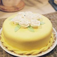 Yellow Fondant Cake This cake is covered with MMF. It was my first attempt with tinting fondant and making fondant roses.