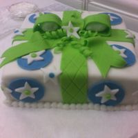 Wilton Class 3---Gift (Package) Cake Fondant covered butter cake with fondant bow, circles, stars, and dots.I had a blast in this class! The instructor and the other students...