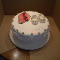 Mackenna's Christening Gumpaste shoes, white chocolate fondant roses and frill.