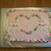 Unicorn Birthday Cake Yellow cake with bavarian cream filling, BC icing, royal icing flowers, and fondant unicorns
