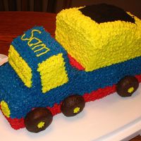 Dump Truck My son's first birthday cake. My husband made fun of the wheel placement...said he has never seen a dump truck like that before!! Oh...
