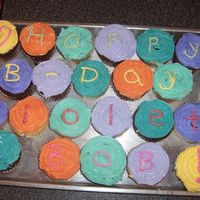 Multi-Colored Cupcakes This was my own birthday cake and my bosses combined. I did chocolate cupcake with white chocolate ganache filling and vanilla cake with...