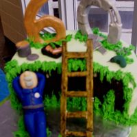 Dad's 60Th The cake is chocolate-raspberry with a ganache filling. Fondant icing and most figues. The 6, 0 and ladder are pastillage.