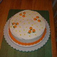 Orange Cake This is an orange flavored cake iced with vanilla flavored buttercream. Decorated with tiny oranges.