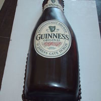 Guinness Bottle For a 21st birthday. Covered on chocolate fondant with edible images.