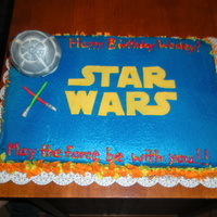Star Wars 1/2 choc , 1/2 yellow cake with butter cream and fondant accents. For a friend's son's bday party