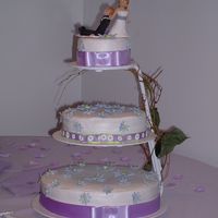 Purple Daisy Wedding This is the wedding cake I did for my sister. I made purple gumpast daisies and dusted them with lustre dust. The cake topper was made by...