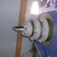 First Wedding Cake The is my first wedding cake, I did it for my BIL. WASC with cheesecake fillig, chocolate with PB filling. The bride told me their colors...