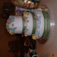 Faye's Retirement Cake This was my first three tiered stacked cake, it resemblles the Leaning Towe of Pisa a bit, bt overall I am happy how it turned out. The...