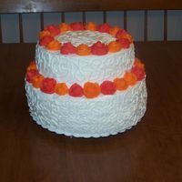 100_7359.jpg This is much simpler than most of the cakes entered, but it is for a very small, informal wedding. Bottom layer is chocolate, top layer is...