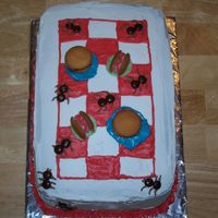 Picnic Cake I got this idea from another forum I'm on. The buns are 'nilla wafers, the hamburgers are snickers, and the hotdogs and plates...