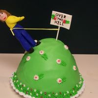Over The Hill This was my first attempt at making a 3-D figure out of fondant. I think next time I'll use gumpaste- the fondant didn't want to...