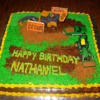 John Deere Tractor Cake I made this cake for my grandson who turned 3. He loves tractors and really enjoyed this cake. I crumbled up some molasses cookies for the...