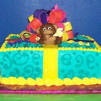 Monkey!!! I made this for my daughter's 9th birthday. The cake is frosted with butter-cream w/a fondant monkey and bow. This was my first try...