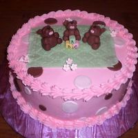 Bb5.jpg This cake was done for a friends&acirc; baby shower. It is a French vanilla cake with whipped strawberry filling. The bears, blanket,...