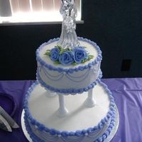 Wedding Cake With Purple Boarder & Flowers This was actually my first tiered cake. It was so much fun and was pretty easy to do. :) Although, I should have added some roses on the...