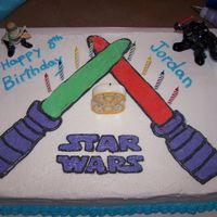 Light Sabers Star Wars cake for sons birthday.