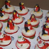 Penguin And Snowman Cupcakes Made these for the staff at my sons elementary. Vanilla with peppermint filling and peppermint icing. I made the penguins out of fondant...