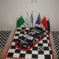 Dale Earnhardt I made this for my uncle's 50th birthday. It was iced in buttercream with fondant squares to make a flag. The car was airbrushed black...