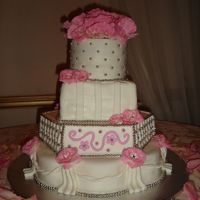 Multi-Shaped Wedding Cake With A Touch Of Rose Accent Well here it is! My FIRST paid wedding cake. Based off a photo from A Piece of Cake in Fort Lauderdale, FL, provided by bride. I'm...