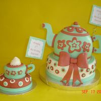 Teapot And Teacup Birthday Cake Made for a 1st birthday tea party! The teacup is the smash cake, a 2" on top of a 4" cake. The tepot was the sports ball on top...