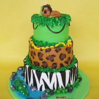 King Of The Jungle This three tiered cake was designed for a little boy turning 6 who was having a "King of the Jungle" themed party. It's a...