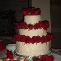 Wedding Cake With Roses My First wedding cake!!!!! Icing was soft due to outside hot and humid... but they stay well put together. Roses are real