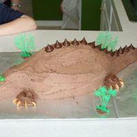 Dinosaur (Part 1) Made this for my son's 3rd Bday... hes into DINOSAURS!!! used cashews for the claws and Hersey kisses for the back... very cute!