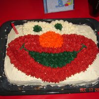 Elmo Made this for my son 1st Bday... did not use an "elmo" pan... I frost it myself using the elmo face as a pattern...