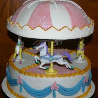 Horse Carousel This cake I made for a friends daughter. I used may new dico glitter, and I love it! It is all fondant exept the horses. They are from...