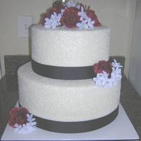 Two Tier Round With Rock Sugar This cake was a 14" and 10", 6 1/4" high tiers - loved it! They were on a budget so the flowers are silk but this cake is...