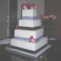4 Tier Square Cake With Zebra Ribbon This cake frosted in buttercream and topped with rock sugar. Such an easy technique and can save a bride some money. Trimmed in grosgain...