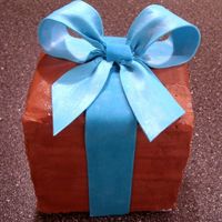 Birthday Gift. Chocolate buttercream icing, fondant ribbon.